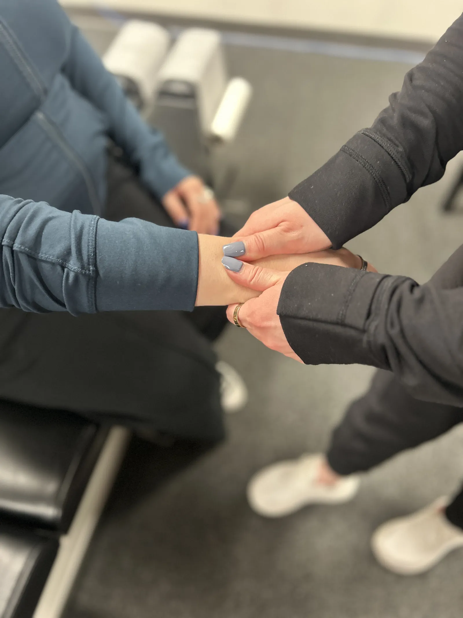 Close-up of a chiropractor working on a patient’s wrist and forearm
