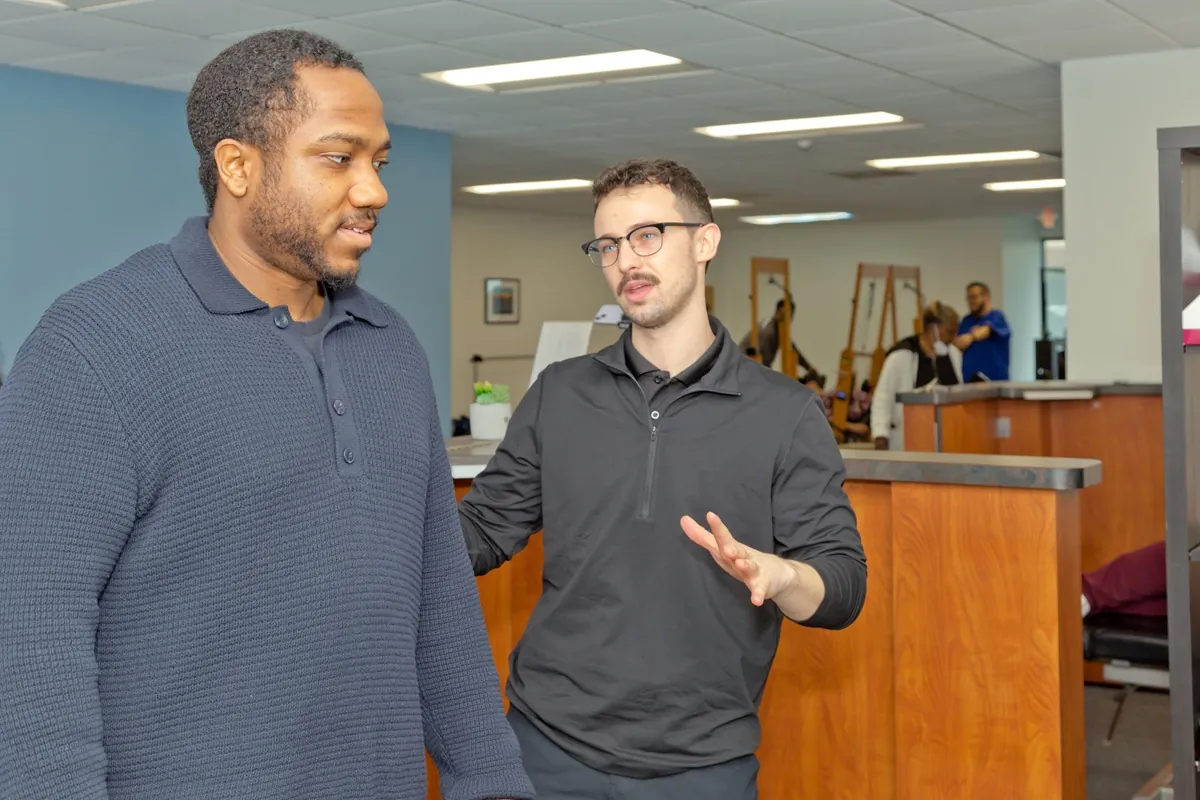 Dr. Connor Reed talking with a patient in the clinic